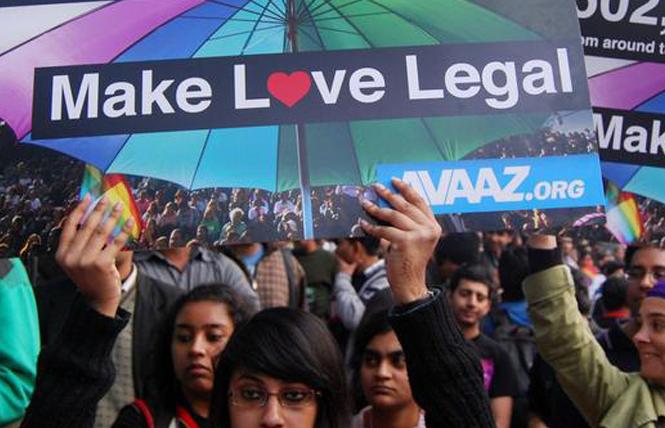 Demonstrators wait outside of India's Supreme Court in Bangalore September 6 for the judges' decision on Section 377, the penal code that criminalized homosexuality in India. Photo: Courtesy IANS