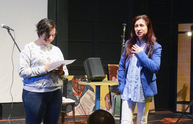 Isabella Torres, right, speaks of the importance of El/La Para TransLatinas for Spanish-speaking transgender people during a musical/social event informing the community about the status of the Redstone Labor Temple Building, where the organization has its meeting rooms. Photo: Rick Gerharter