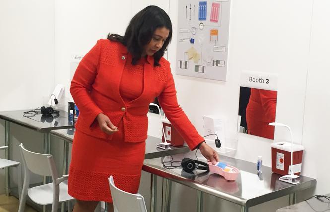 San Francisco Mayor London Breed checked out an injection station at the Safer Inside demonstration last August that was set up to show the public what a safe injection facility might look like. Photo: Liz Highleyman
