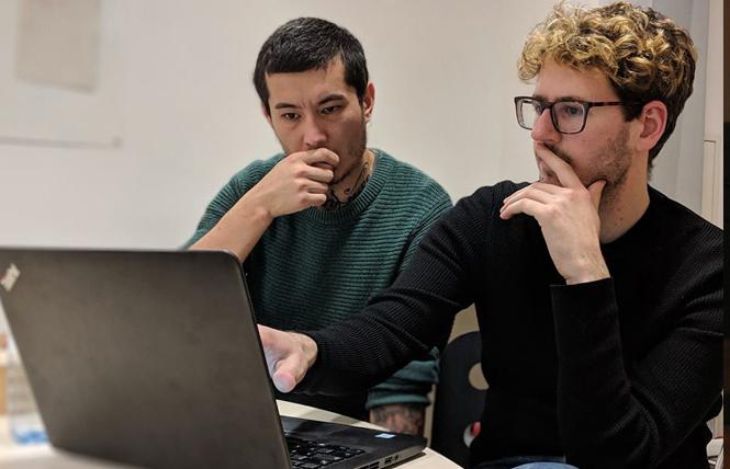 Ali Feruz, left, and Andreas Schmiedecker, two of the co-founders of Unit, a journalist network in Eastern Europe and Central Asia, work in the project's Berlin office. Photo: Courtesy of Ali Feruz/Facebook