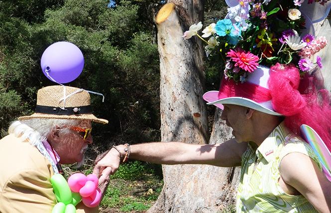 Miguel of Les Noche, left, kisses the hand of the Easter bonnet contest winner, Todd Atkins-Whitley, at the 2018 Sisters of Perpetual Indulgence's annual Easter celebration that was held in Golden Gate Park. Photo: Rick Gerharter