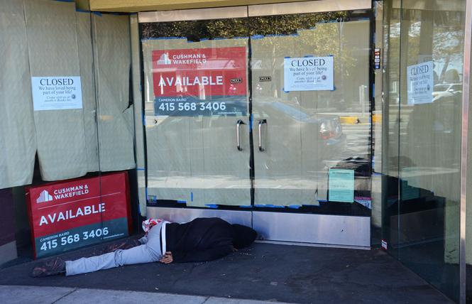 A person sleeps in the doorway in the Castro in this 2016 file photo. Photo: Rick Gerharter