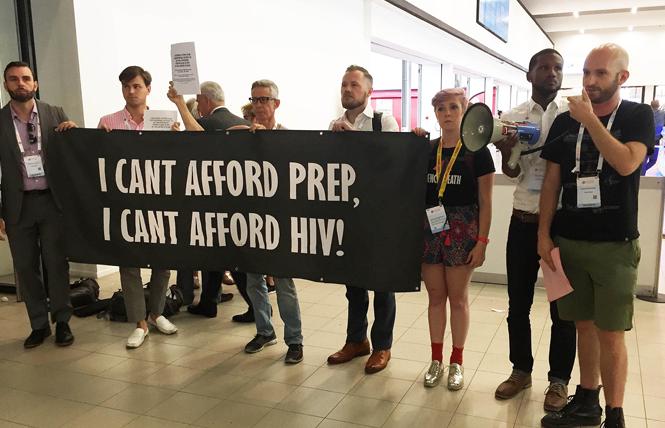 James Krellenstein, right, with the PrEP4All coalition, speaks during a demonstration at the International AIDS Conference in Amsterdam last year. Photo: Liz Highleyman