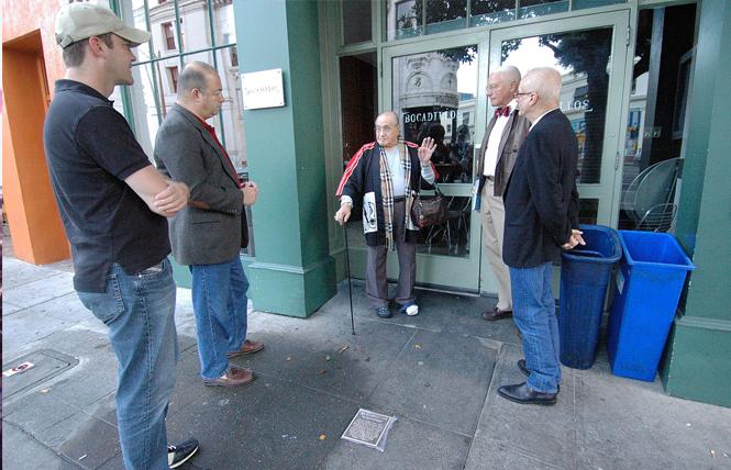 Standing in front of the site of the Black Cat bar in October 2013, Jose Sarria, center, reminisced about his time at the bar to, from left, an unidentified man, Don Berger, John Newmeyer, and then-reigning Emperor Michael Dumont. The occasion was the installation of a plaque, seen here in the sidewalk, honoring the significance of the bar to San Francisco's LGBT history. Photo: Rick Gerharter