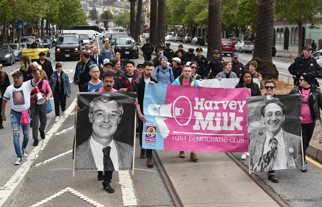 Marchers commemorated the 40th anniversary of the White Night riots Tuesday, May 21, and walked to City Hall carrying pictures of then-mayor George Moscone, left, and supervisor Harvey Milk, who were assassinated by disgruntled ex-supervisor Dan White. Photo: Gooch