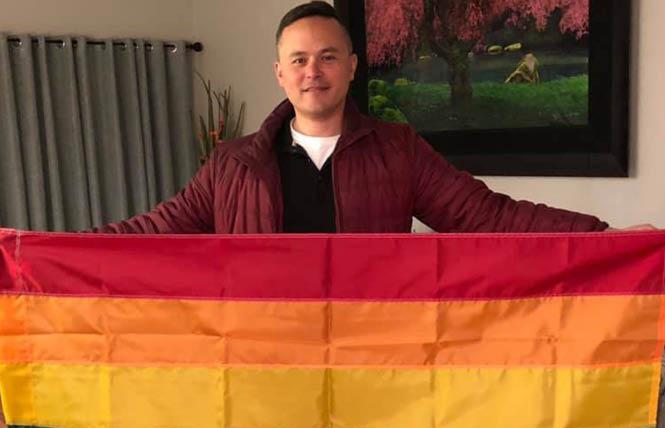 Gay Dublin City Councilman Shawn Kumagai holds a Pride flag he hopes will soon fly in front of the East Bay city's City Hall. Courtesy: Facebook