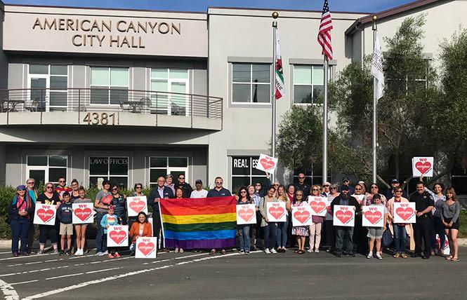 City officials and community members gathered in front of American Canyon City Hall to raise the Pride flag. Photo: Courtesy LGBTQ Connection