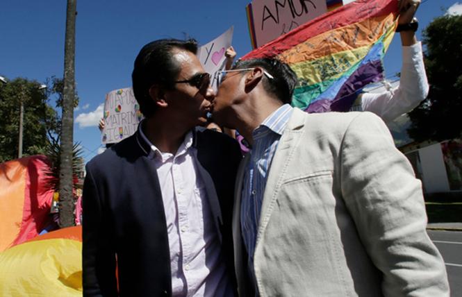Same-sex marriage plaintiffs Javier Benalcazar, left, and his partner, Efrain Soria, kissed as they arrived to learn about the final decision of the Constitutional Court. Photo Credit: AP