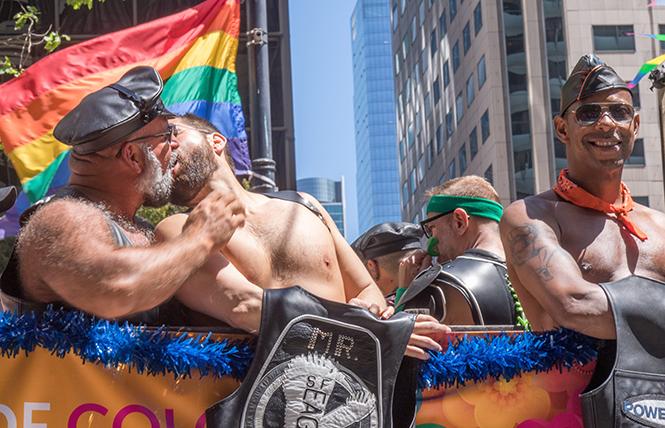 Marc Jordan (left) and Manuel Ojeda (right) share a passionate smooch aboard the Leather Pride float at SF Pride on June 30. photo: Rich Stadtmiller