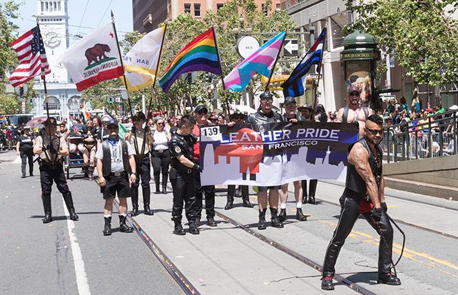 The Leather Contingent in this years SF Pride Parade was large with a great cross-section of leather and kink communities represented. Danny Thanh Nguyen led the contingent with a bullwhip display. photo: Rich Stadtmiller