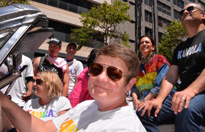 Kamala Harris and her husband, Douglas Emhoff, rode in Sunday's San Francisco Pride parade. They were driven by Kris Perry, who was joined by her spouse, Sandra Stier. Harris married the women in 2013. Photo: Bill Wilson