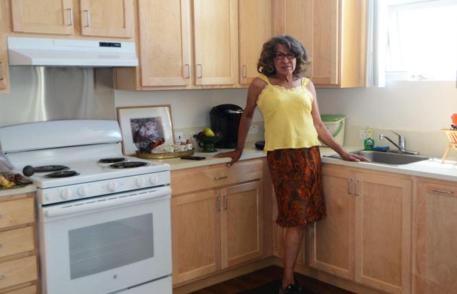 Donna Personna is thrilled with her new apartment at Openhouse's 95 Laguna Street senior housing complex. Photo: Rick Gerharter