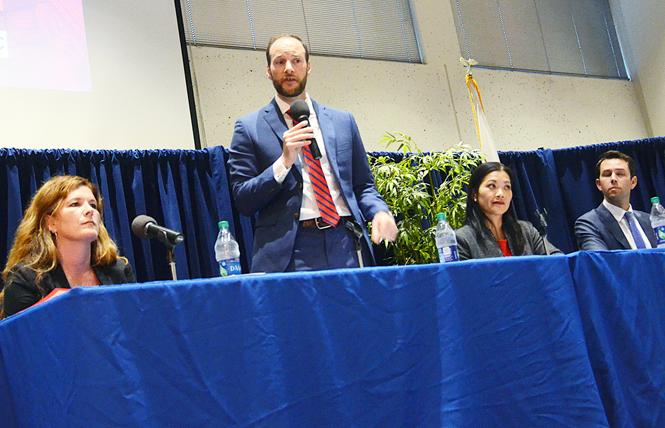 San Francisco district attorney candidate Chesa Boudin, second from left, speaks at a forum Tuesday at UC Hastings College of the Law. Other candidates, from left, are Suzy Loftus, Nancy Tung, and Leif Dautch. Photo: Rick Gerharter