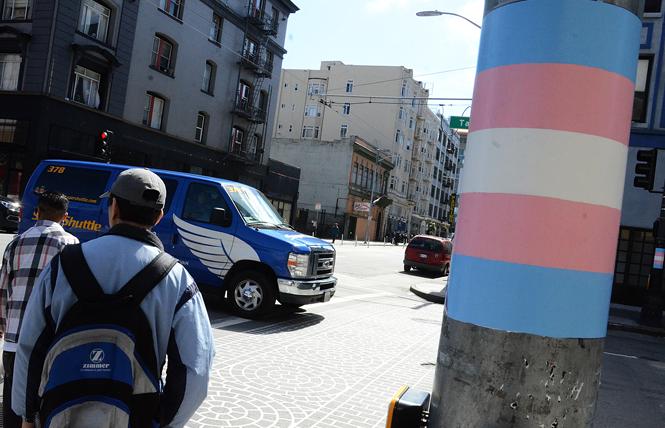 Placemaking has already started in the Compton's Transgender Cultural District. In late May, the colors of the transgender flag were painted on the streetlight poles around the intersection of Turk (Vicki Mar Lane) and Taylor (Gene Compton's Cafeteria Way) Streets in San Francisco's Tenderloin district. Photo: Rick Gerharter