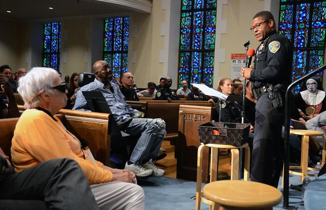 At an August 26 meeting at Glide Memorial Church, San Francisco Police Chief William Scott apologizes directly to Joanne Chadwick, left, for abusive treatment by the police department against the LGBTQ community. Chadwick attended the New Year's Eve party in 1965 at California Hall that was raided by the police and led to widespread criticism of the police department. Photo: Rick Gerharter