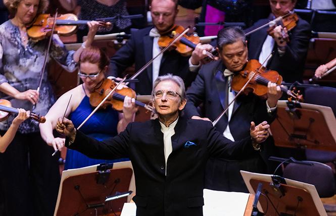 Michael Tilson Thomas leads the SFS Opening Gala audience in the National Anthem. Photo: Drew Altizer