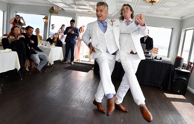 Newlyweds Carlos Eugenio Venturo Diaz-Copley, and Joseph William Copley-Venturo Diaz dance a one-step aboard the California Hornblower. photo: Steven Underhill