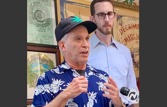 David Goldman, left, president of the Brownie Mary Democratic Club, spoke at a news conference with state Senator Scott Wiener about an indigent cannabis bill. Photo: Sari Staver