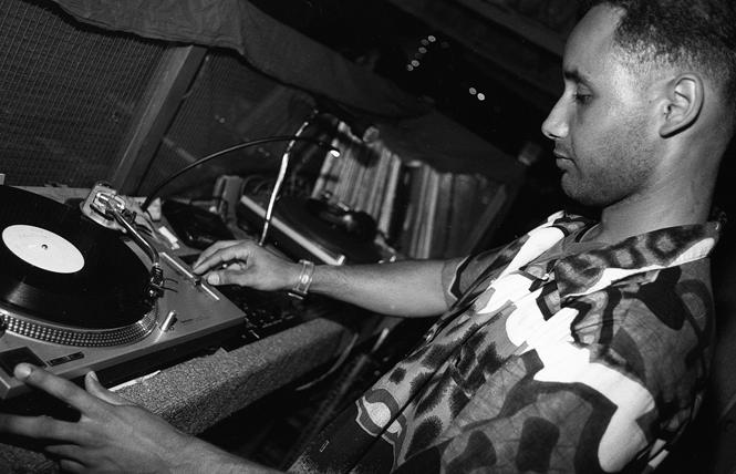 DJ Tim Luster spins the music at Club N'Zinga night at El Rio bar May 15, 1992. Photo: Rick Gerharter