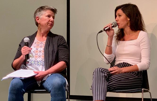 Jodi Schwartz, left, executive director of LYRIC, and Stephany Ashley of Brilliant Colors talk about the All In homeless campaign at an October 1 meeting. Photo: Sari Staver