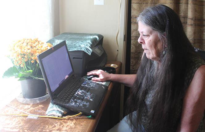 Loreen Willenberg works on her laptop in her home office. Photo: Bob Roehr
