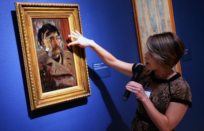 Sarah Kleiner, a paintings conservator at the Fine Arts Museums, discusses painting techniques of James Tissot's "Self Portrait," part of the exhibit "James Tissot: Fashion & Faith" at the Legion of Honor. Photo: Rick Gerharter