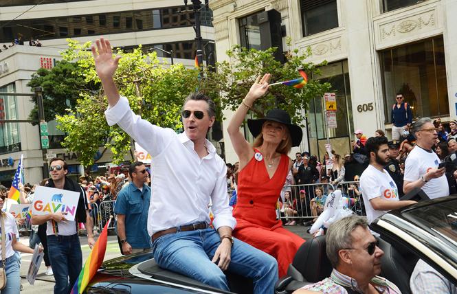 Governor Gavin Newsom, and his wife, first partner Jennifer Siebel Newsom, rode in this year's San Francisco Pride parade. Photo: Rick Gerharter