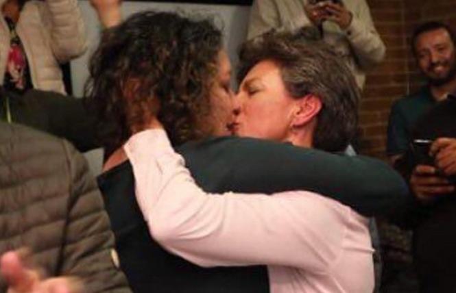 Bogotá mayor-elect Claudia Lopez kissed her partner, Angélica Lozano Correa, during her election celebration Sunday. Photo: Renata Segura via Instagram