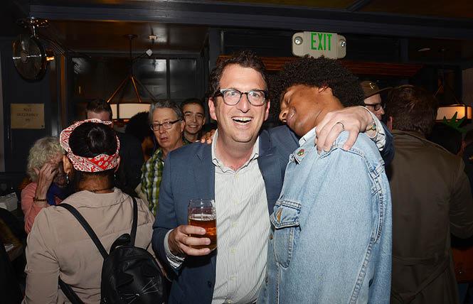 District 5 Supervisor candidate Dean Preston, left, gets a hug from supporter Basil Saleh at Preston's election night party in Hayes Valley. Photo: Rick Gerharter