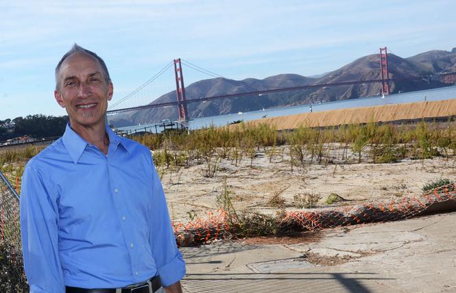 Michael Boland, chief of park development and visitor engagement for the Presidio Trust, stands atop the tunnels that replaced the former Doyle Drive leading to the Golden Gate Bridge. Photo: Rick Gerharter