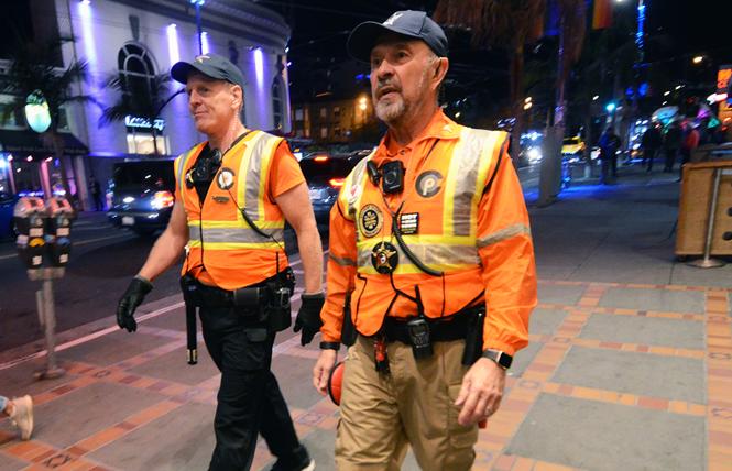 Castro Community on Patrol officers Brian Hill, left, and Greg Carey walk about the Castro neighborhood on a recent Friday night. Photo: Rick Gerharter