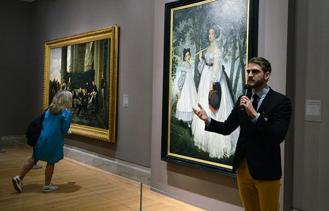Musée D'Orsay paintings curator Paul Perrin, co-curator of the exhibit "James Tissot: Fashion and Faith" at the Legion of Honor, discusses two paintings, "The Circle of the Rue Royale" and "The Two Sisters: Portrait." Photo: Rick Gerharter