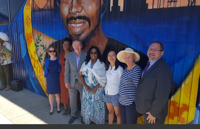 BART directors Rebecca Saltzman, left; Lateefah Simon; then-board President Bevan Dufty; Oscar Grant's mother, Wanda Johnson; and BART directors Janice Li; Liz Ames; and Mark Foley attended a June unveiling of the mural of Grant at the Fruitvale BART station, the site of Grant's killing by a BART police officer in 2009. Photo: Courtesy BART