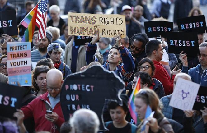 People rallied at the Stonewall National Monument in New York City in February 2017 to protest President Donald Trump's decision to roll back a federal rule saying public schools had to allow transgender students to use the bathrooms and locker rooms of their chosen gender identity. Photo: Courtesy AP