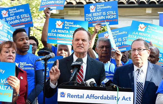 Michael Weinstein, president of the AIDS Healthcare Foundation, spoke at a Los Angeles news conference and rally December 5 at Placita Olivera to announce the submission of nearly one million voter signatures to qualify the Rental Affordability Act, a ballot initiative that would allow for the expansion of rent control in California. Photo: Courtesy AP