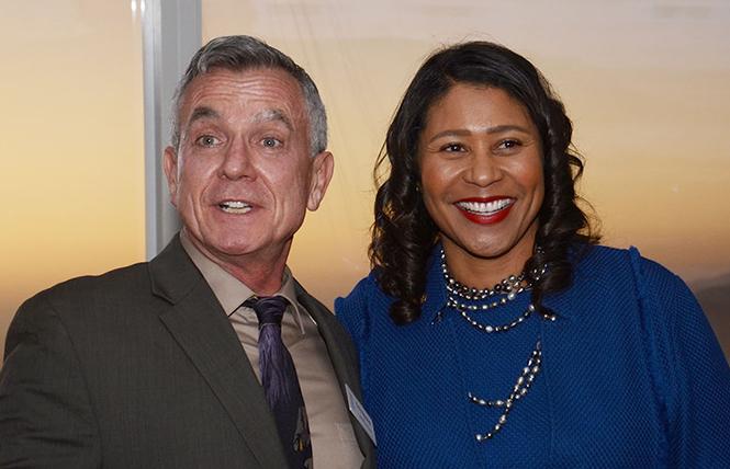 GLBT Historical Society Executive Director Terry Beswick, left, was joined by Mayor London Breed at the organization's gala atop Salesforce Tower in October. Photo: Rick Gerharter