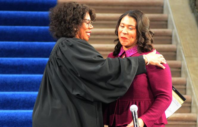 San Francisco Superior Court Judge Teri Jackson, left, embraces Mayor London Breed as she prepares to swear in the mayor to a four-year term Wednesday at City Hall. Photo: Rick Gerharter