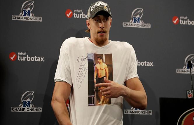 49ers tight end George Kittle wore a T-shirt featuring a shirtless image of quarterback Jimmy Garoppolo at a postgame news conference. Photo: Courtesy Screenshot