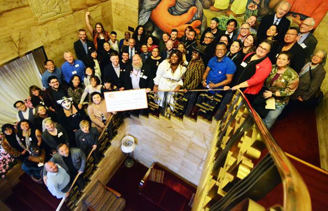 Recipients, past and present, of grants from Horizons Foundation gathered on the stairway in City Club of San Francisco for a group photo. Photo: Rick Gerharter