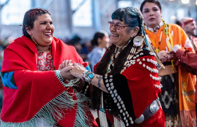 Lushanya Echeverria, left, and Beverly Little Thunder took part in the round dance at the BAAITS two-spirit powwow in San Francisco. Photo: Jane Philomen Cleland