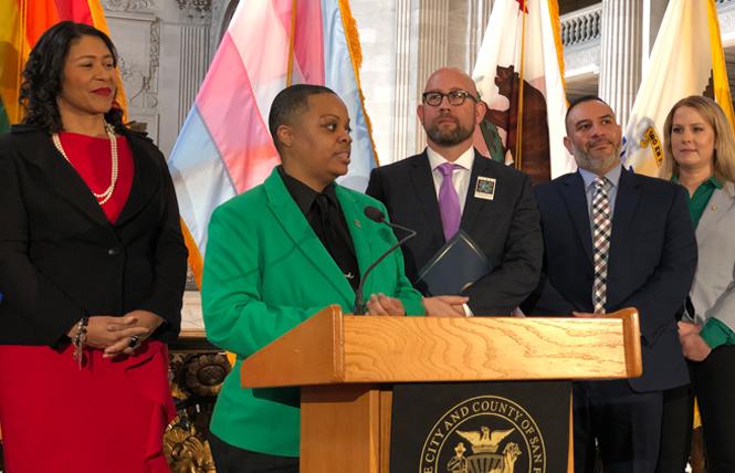 SF Pride board President Carolyn Wysinger speaks at a media event Tuesday, where she was joined by Mayor London Breed, left, Supervisor Rafael Mandelman, SF Pride Executive Director Fred Lopez, and Clair Farley, director of the Office of Transgender Initiatives. Photo: John Ferrannini