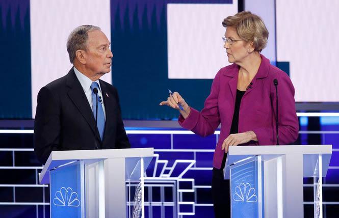 Senator Elizabeth Warren, right, makes a point to former New York City mayor Michael Bloomberg at Wednesday's Democratic presidential debate in Las Vegas. Photo: AP