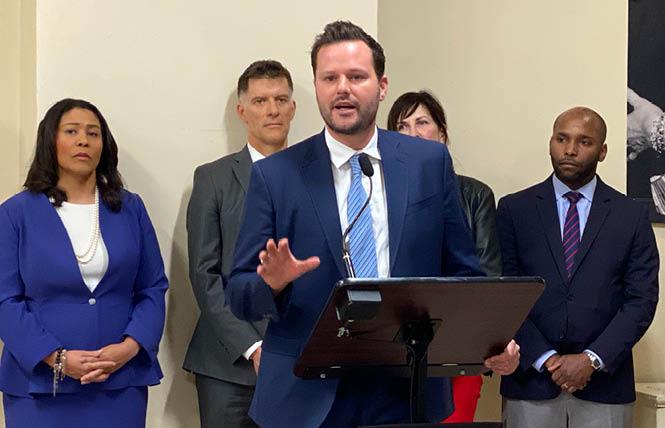 District 6 Supervisor Matt Haney, joined by Mayor London Breed, left, and Health Director Dr. Grant Colfax (behind Haney) at a Thursday news conference, discussed the city's proposed legislation to prepare for supervised injection facilities. Photo: Liz Highleyman