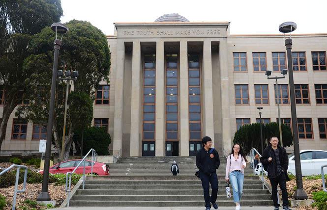 People walk past Science Hall on the main campus of City College of San Francisco. Photo: Rick Gerharter