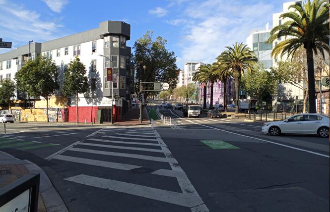 Empty streets like this at Valencia and Market were the new normal in San Francisco beginning Tuesday morning. Photo: Scott Wazlowski