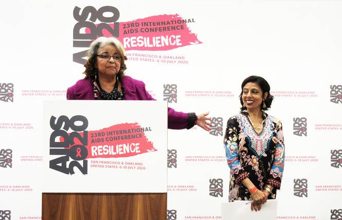 Cynthia Carey-Grant, left, gestures to her fellow AIDS 2020 co-chair, Dr. Monica Gandhi, at a conference kickoff event last fall in San Francisco. Photo: Liz Highleyman