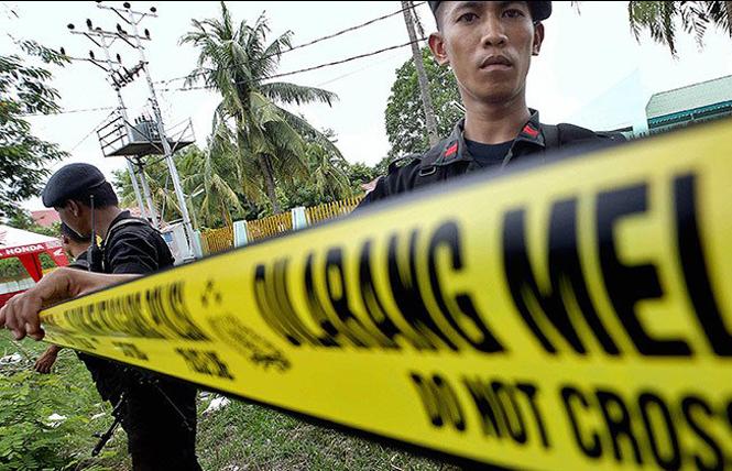 Indonesian police arrive at a crime scene. Photo: Courtesy of Shutterstock