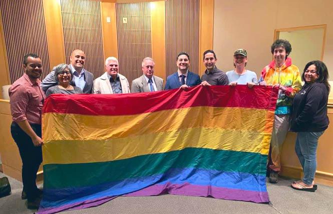 Members of the Lambda Democratic Club of Contra Costa County brought a Pride flag with them to a Pinole City Council meeting last year at which their request to see the East Bay city fly the LGBT symbol during June was approved. Photo: Courtesy the Lambda club.
