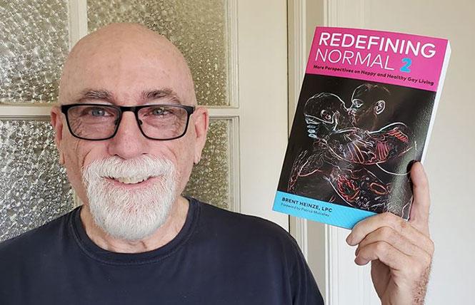 Race Bannon with his latest reading selection, Brent Heinze's 'Redefining Normal 2.' photo: Mike Pierce