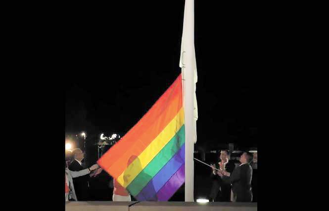 Dublin Mayor David Haubert, second from right, and City Councilman Shawn Kumagai, holding rope, raised the rainbow flag outside City Hall last year. Photo: Courtesy Facebook